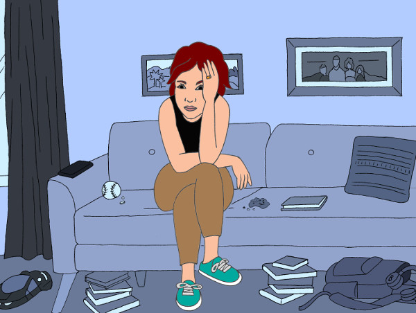 April sits alone on her couch. The room is messy, and she rests her head in her hands.